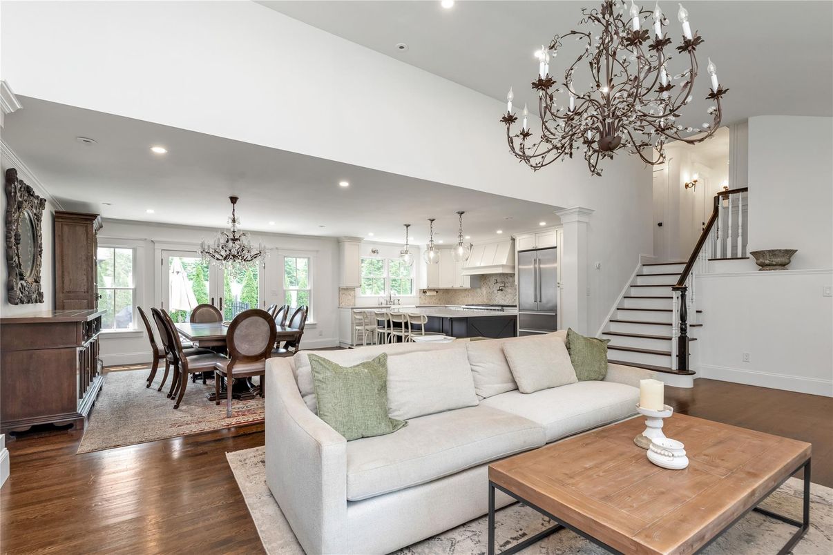 Chandelier, Dining room, Interior, Kitchen, Living room, Pendant Lights, Recessed Lighting, Stainless Steel Appliances, Wood Texture Flooring