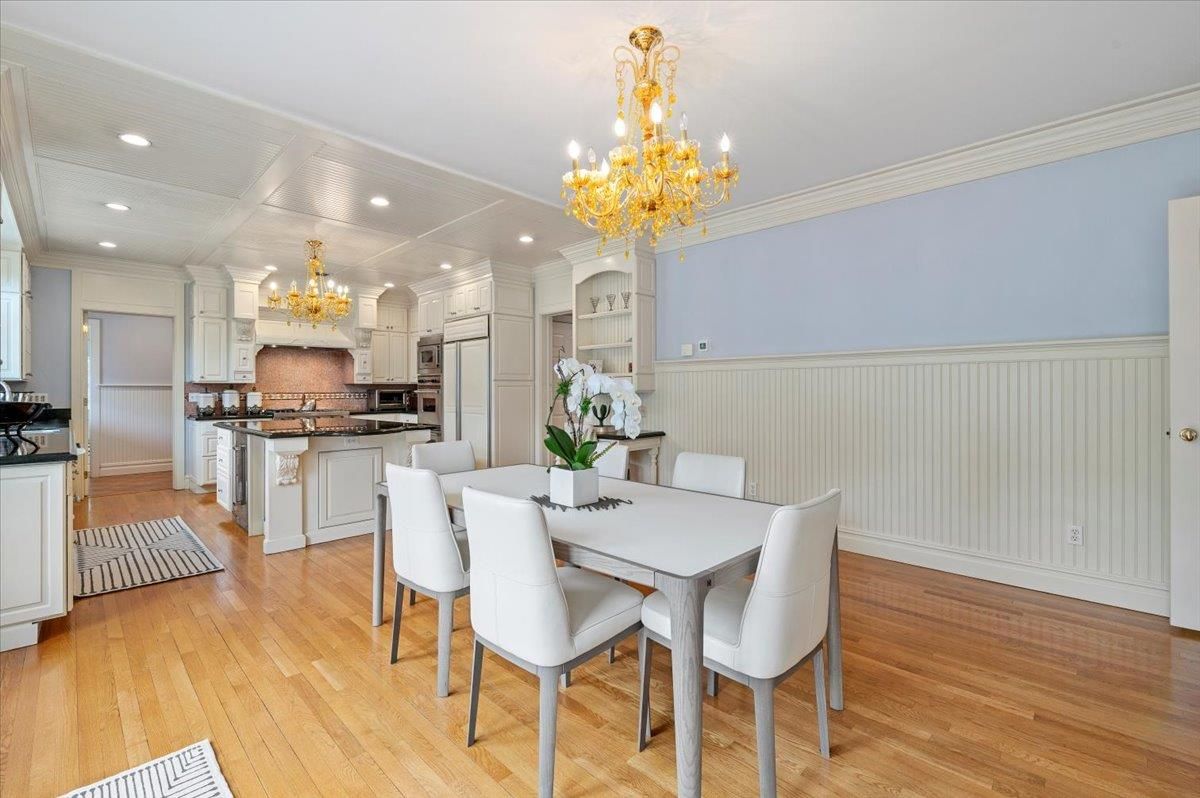 Chandelier, Dining room, Interior, Kitchen, Recessed Lighting, Stainless Steel Appliances, Wood Texture Flooring