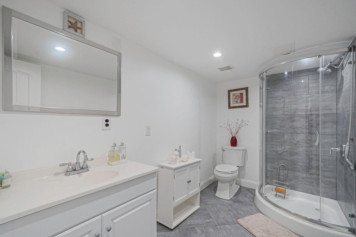 Bathroom, Dual Sink Vanities, Glass Shower, Interior, Recessed Lighting, Wood Texture Flooring