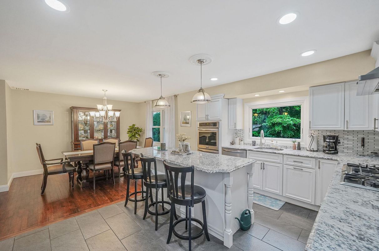 Chandelier, Dining room, Interior, Kitchen, Pendant Lights, Recessed Lighting, Stainless Steel Appliances, Wood Texture Flooring