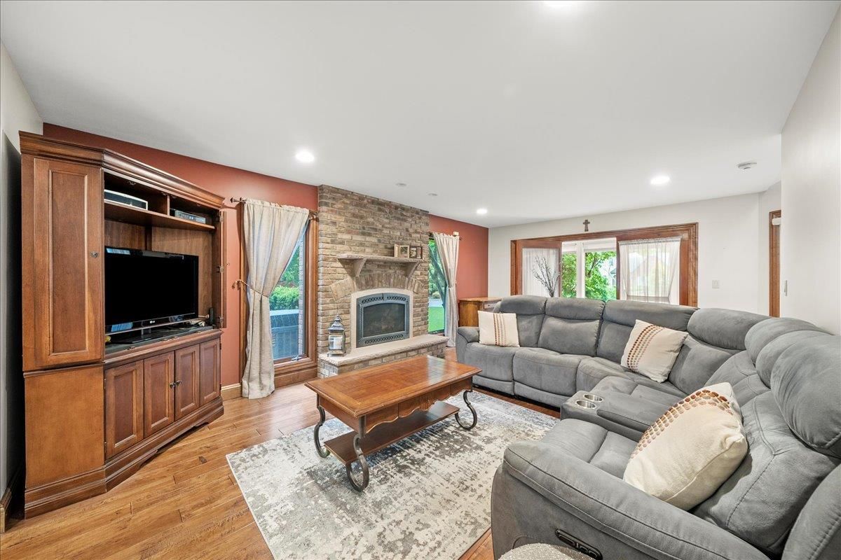 Fireplace, Interior, Living room, Recessed Lighting, Stone Walls, Wood Texture Flooring