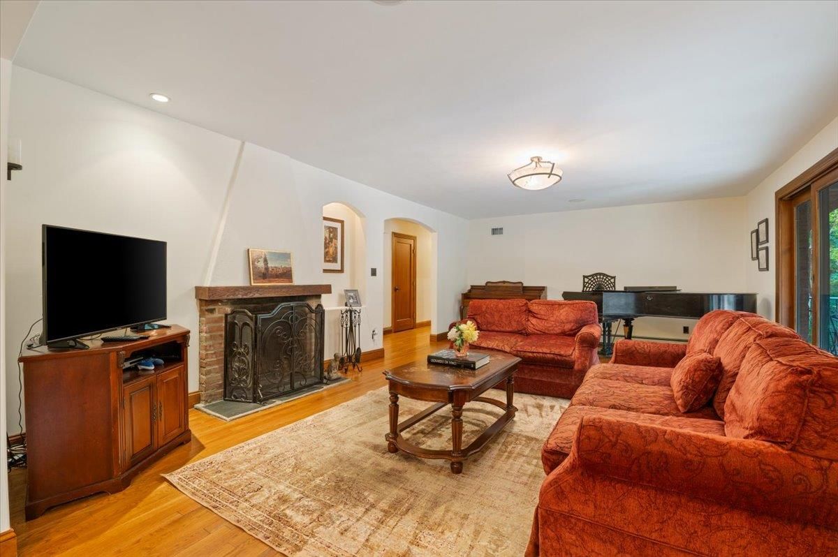 Fireplace, Interior, Living room, Piano, Recessed Lighting, Wood Texture Flooring