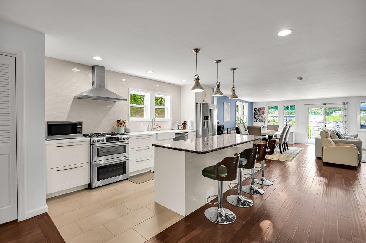 Dining room, Interior, Kitchen, Living room, Pendant Lights, Recessed Lighting, Stainless Steel Appliances, Wood Texture Flooring