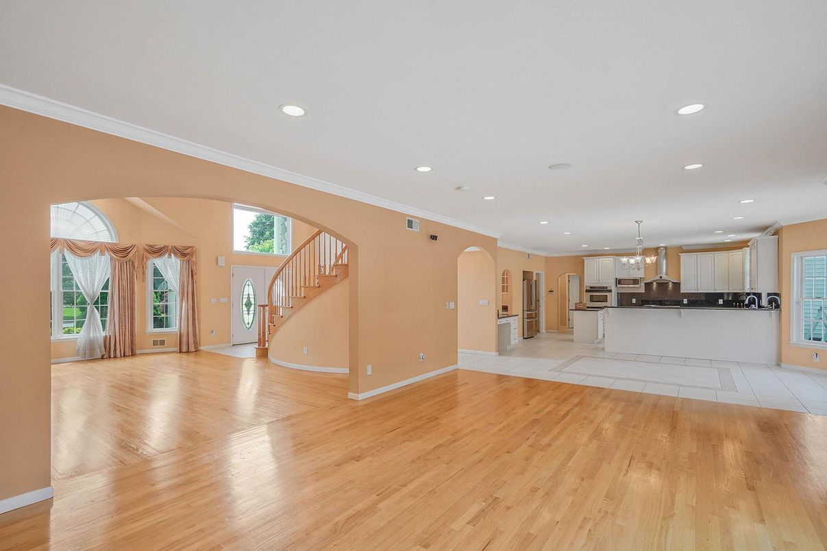 Empty room, Interior, Kitchen, Pendant Lights, Recessed Lighting, Stainless Steel Appliances, Wood Texture Flooring