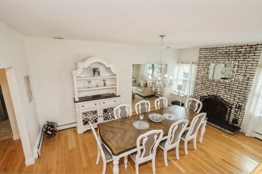 Chandelier, Dining room, Fireplace, Interior, Stone Walls, Wood Texture Flooring