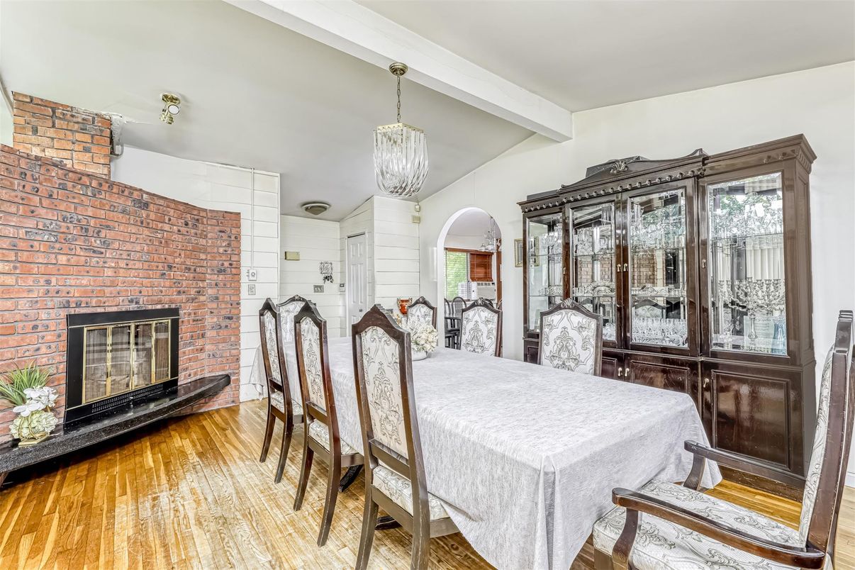 Dining room, Fireplace, Interior, Pendant Lights, Stone Walls, Wood Texture Flooring