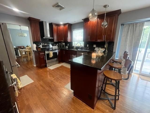 Dining room, Interior, Kitchen, Pendant Lights, Recessed Lighting, Stainless Steel Appliances, Wood Texture Flooring