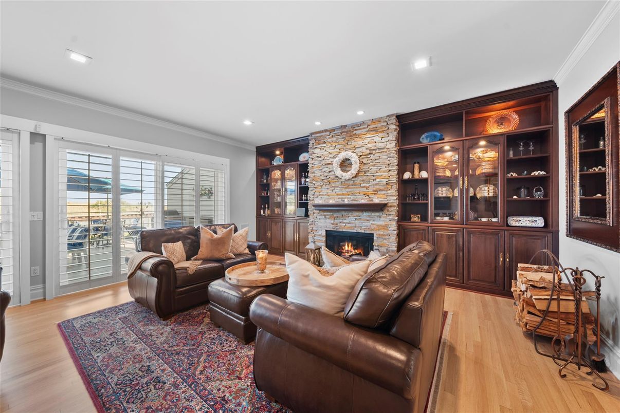Fireplace, Interior, Living room, Recessed Lighting, Stone Walls, Wood Texture Flooring