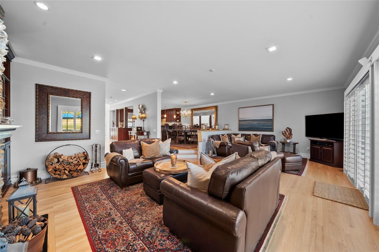 Dining room, Fireplace, Interior, Living room, Recessed Lighting, Wood Texture Flooring