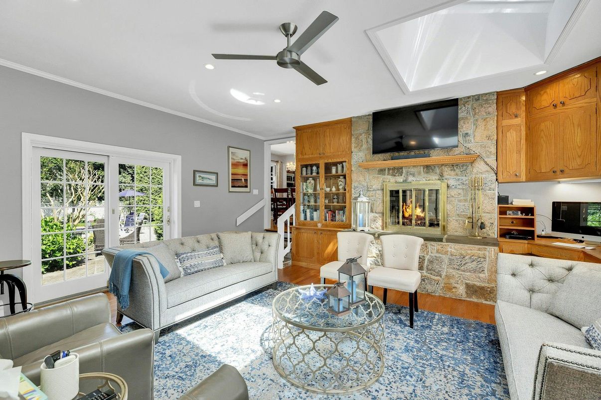 Fireplace, Interior, Living room, Recessed Lighting, Stone Walls, Wood Texture Flooring