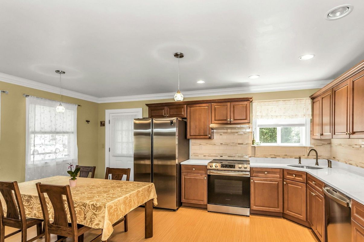 Dining room, Interior, Kitchen, Pendant Lights, Recessed Lighting, Stainless Steel Appliances, Wood Texture Flooring