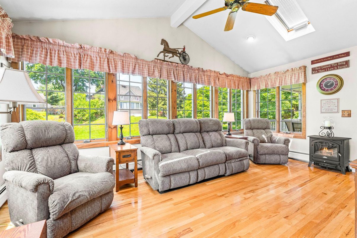Fireplace, Interior, Living room, Recessed Lighting, Sun Room, Wood Texture Flooring