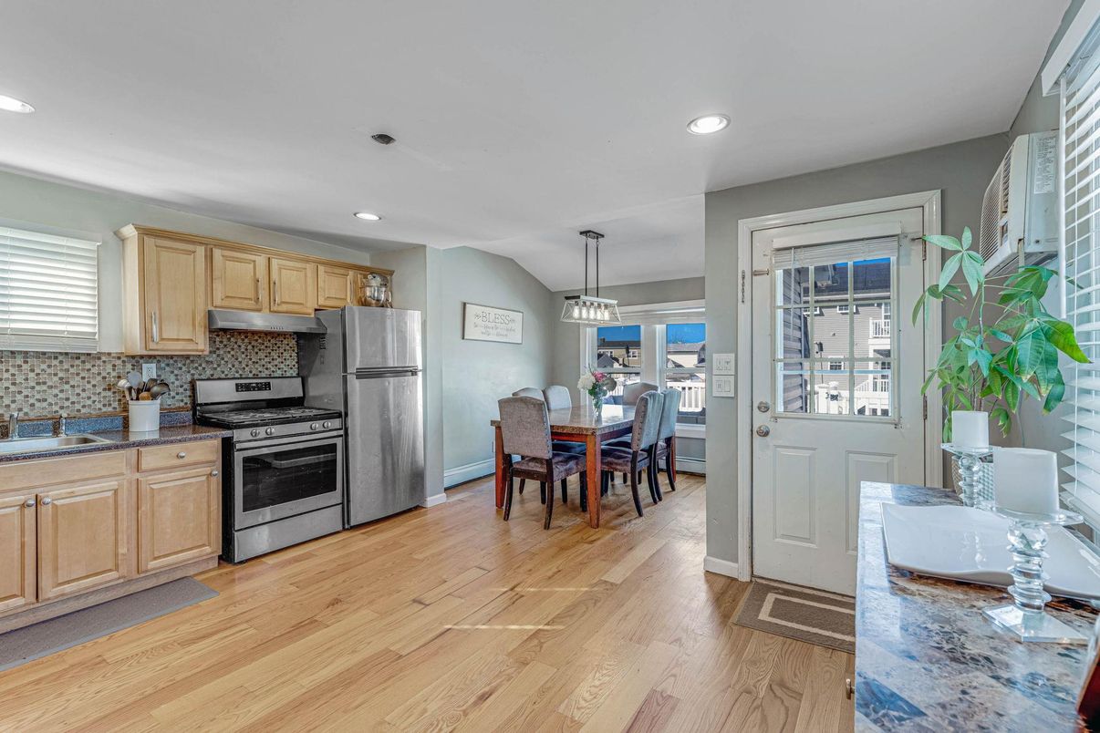 Dining room, Interior, Kitchen, Pendant Lights, Recessed Lighting, Stainless Steel Appliances, Wood Texture Flooring