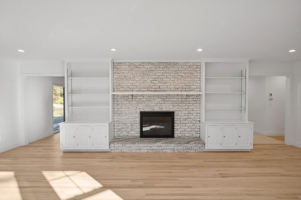 Empty room, Fireplace, Interior, Recessed Lighting, Stone Walls, Wood Texture Flooring
