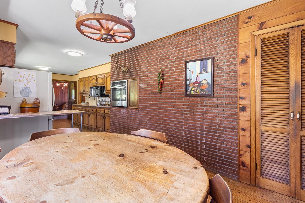 Dining room, Interior, Kitchen, Pendant Lights, Recessed Lighting, Stainless Steel Appliances, Stone Walls, Wood Texture Flooring