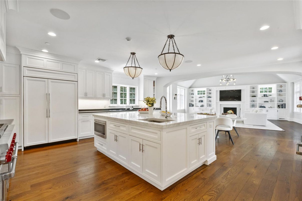 Chandelier, Fireplace, Interior, Kitchen, Living room, Pendant Lights, Recessed Lighting, Wood Texture Flooring