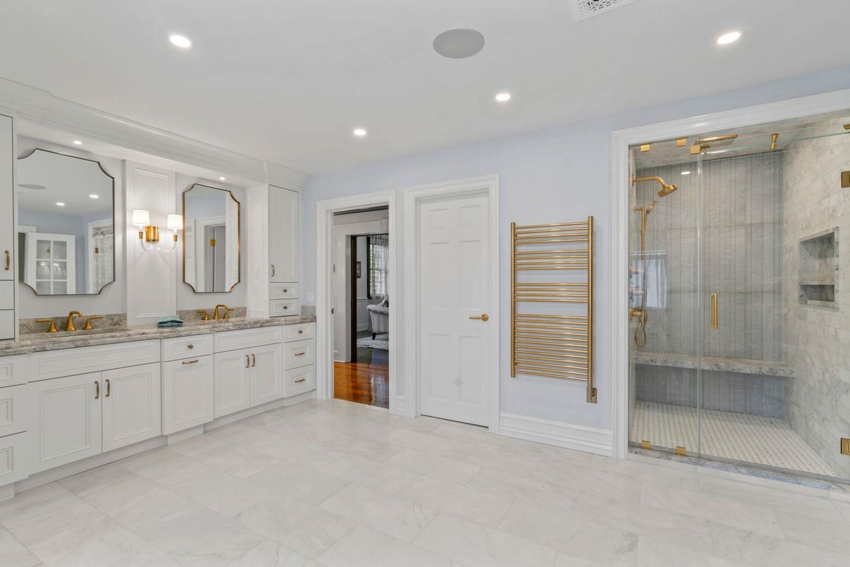 Bathroom, Dual Sink Vanities, Glass Shower, Interior, Marble, Recessed Lighting, Wood Texture Flooring