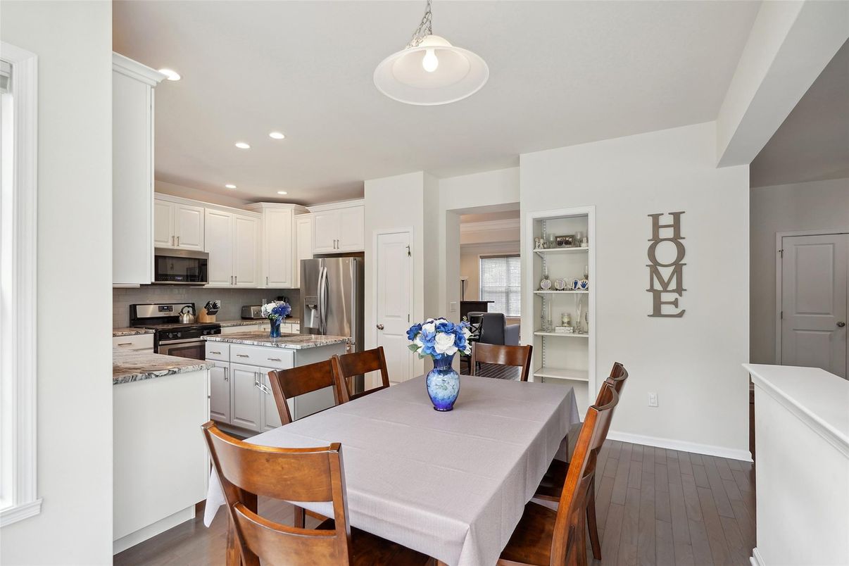 Dining room, Interior, Kitchen, Pendant Lights, Recessed Lighting, Stainless Steel Appliances, Wood Texture Flooring