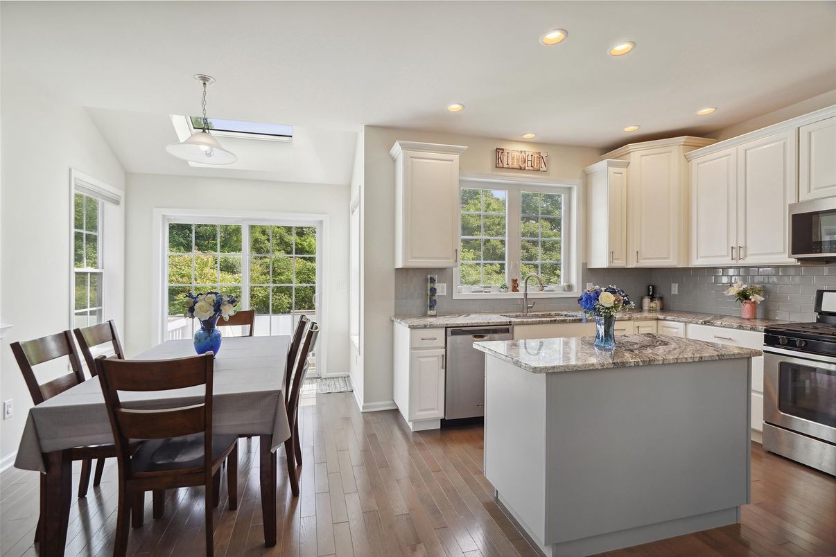 Dining room, Interior, Kitchen, Pendant Lights, Recessed Lighting, Stainless Steel Appliances, Wood Texture Flooring