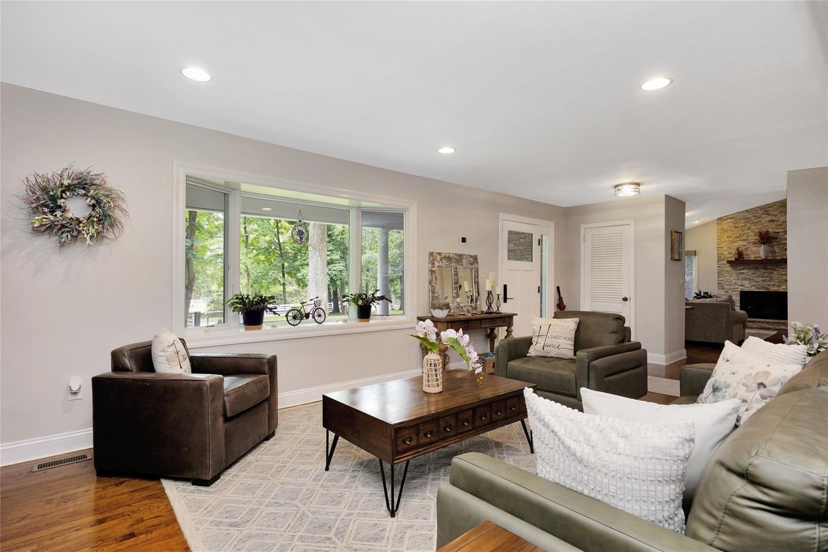 Fireplace, Interior, Living room, Recessed Lighting, Stone Walls, Wood Texture Flooring