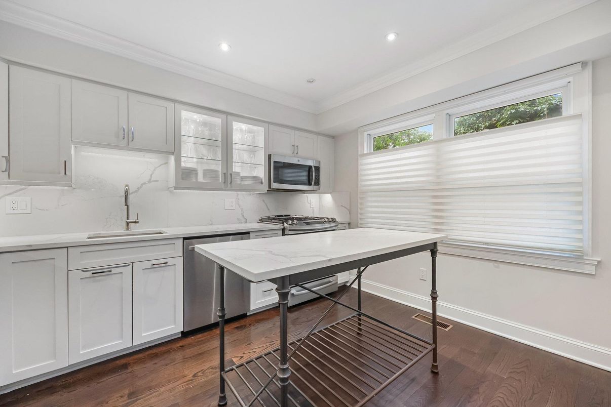 Interior, Kitchen, Marble Walls, Recessed Lighting, Stainless Steel Appliances, Wood Texture Flooring