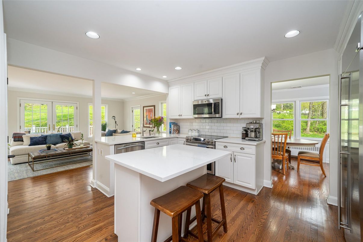 Dining room, Interior, Kitchen, Living room, Recessed Lighting, Stainless Steel Appliances, Wood Texture Flooring