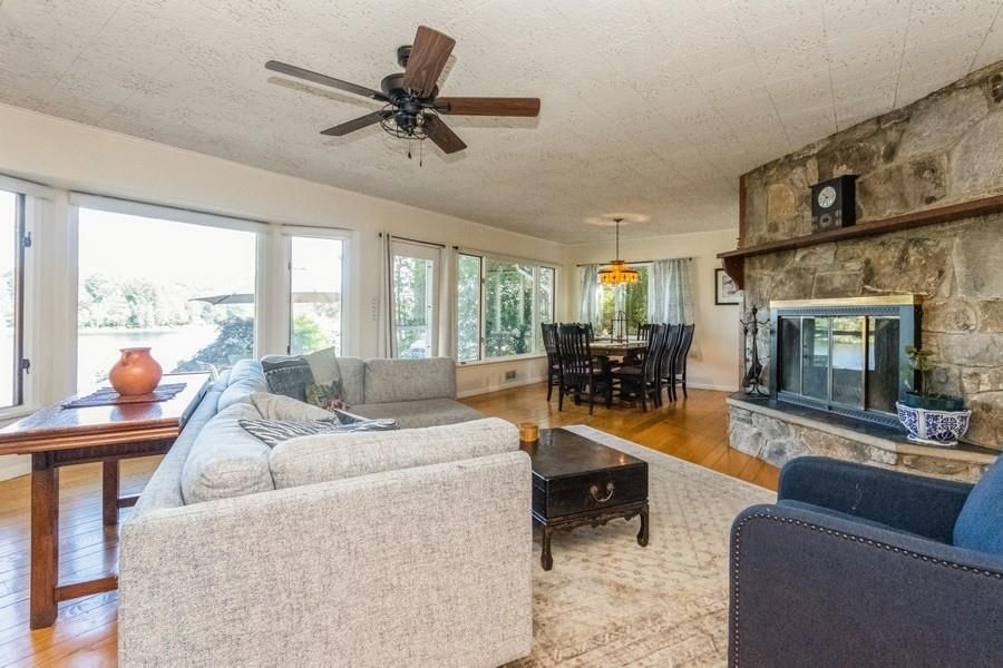 Dining room, Fireplace, Interior, Living room, Pendant Lights, Stone Walls, Wood Texture Flooring