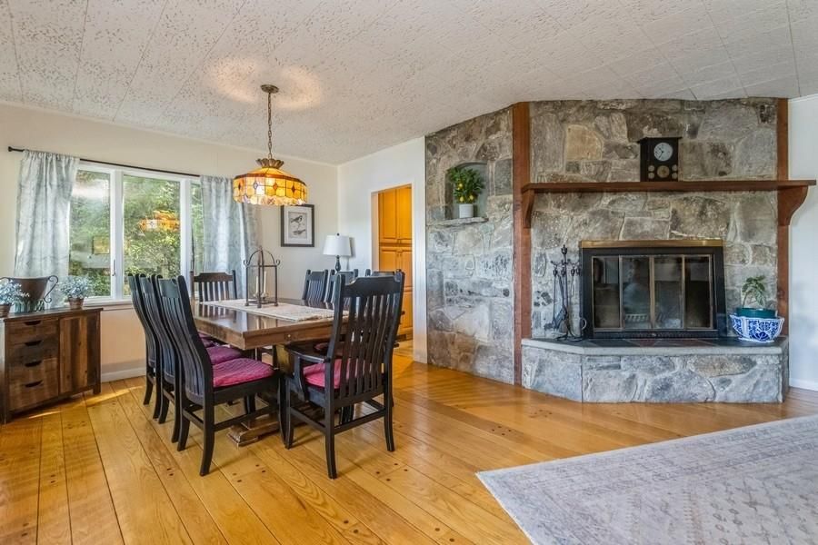 Dining room, Fireplace, Interior, Pendant Lights, Stone Walls, Wood Texture Flooring