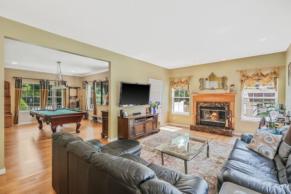 Billiard Table, Fireplace, Game Room, Interior, Living room, Pendant Lights, Recessed Lighting, Wood Texture Flooring
