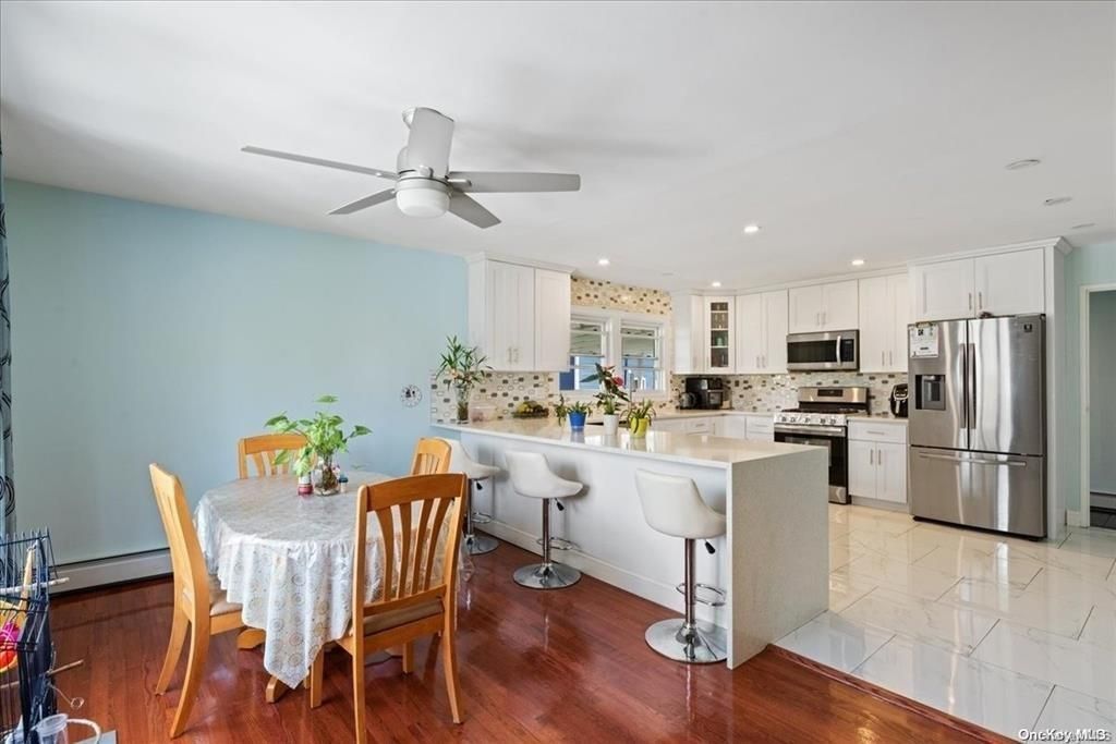 Dining room, Interior, Kitchen, Marble, Recessed Lighting, Stainless Steel Appliances, Wood Texture Flooring