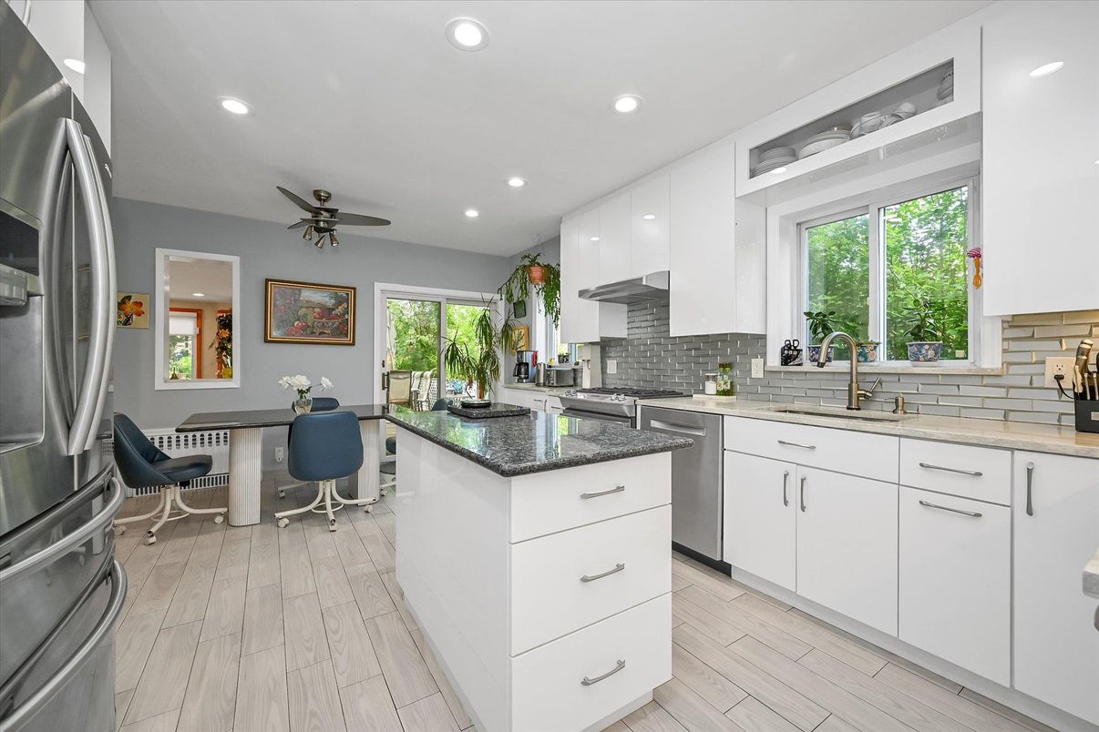Dining room, Interior, Kitchen, Recessed Lighting, Stainless Steel Appliances, Wood Texture Flooring