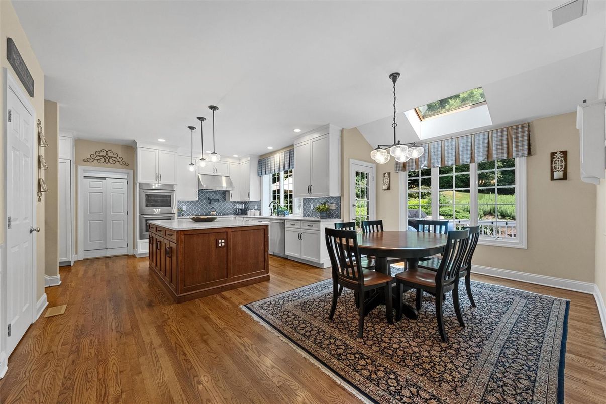 Dining room, Interior, Kitchen, Pendant Lights, Recessed Lighting, Stainless Steel Appliances, Wood Texture Flooring