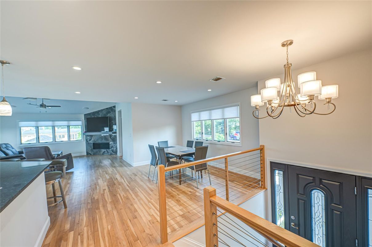 Chandelier, Dining room, Fireplace, Interior, Living room, Recessed Lighting, Wood Texture Flooring