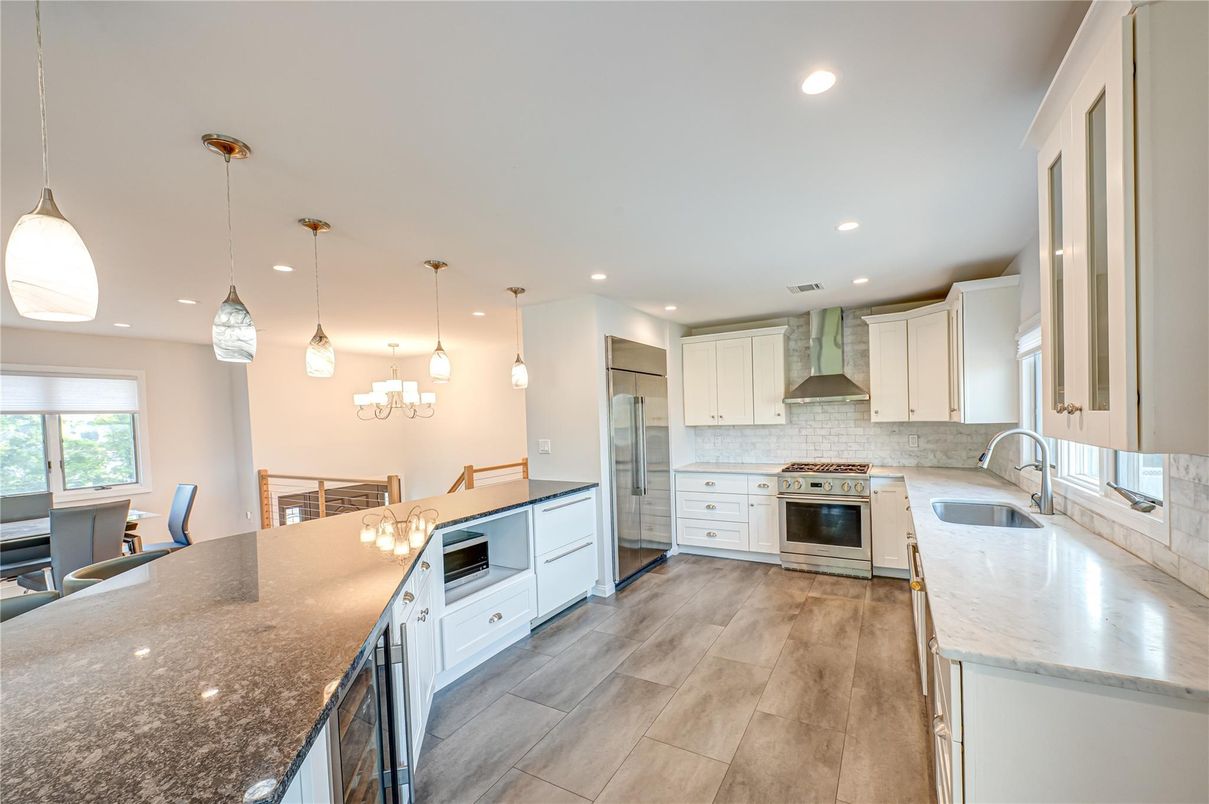 Dining room, Interior, Kitchen, Pendant Lights, Recessed Lighting, Stainless Steel Appliances, Wood Texture Flooring