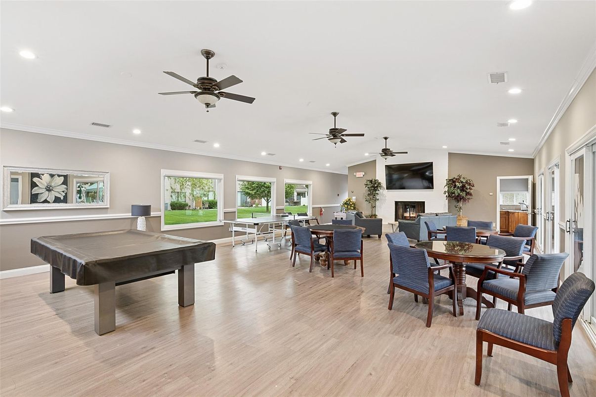 Billiard Table, Dining room, Fireplace, Game Room, Interior, Living room, Recessed Lighting, Wood Texture Flooring