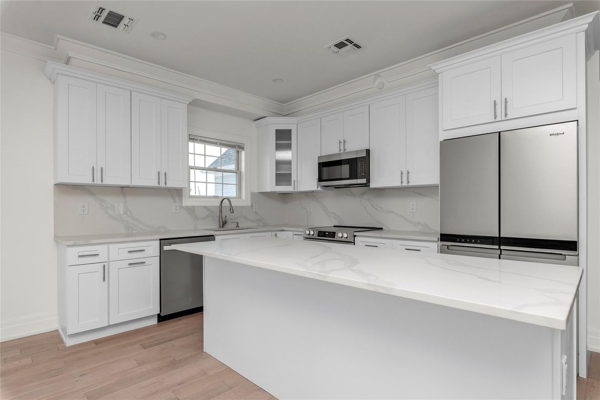 Interior, Kitchen, Marble Walls, Recessed Lighting, Stainless Steel Appliances, Wood Texture Flooring
