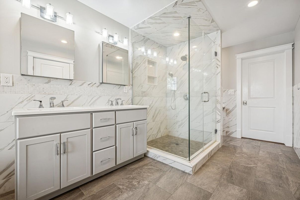 Bathroom, Dual Sink Vanities, Glass Shower, Interior, Marble Walls, Recessed Lighting
