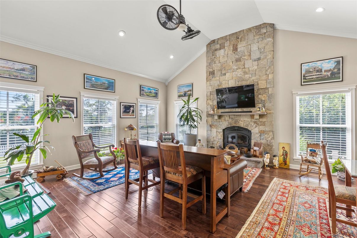Dining room, Fireplace, Interior, Recessed Lighting, Stone Walls, Wood Texture Flooring