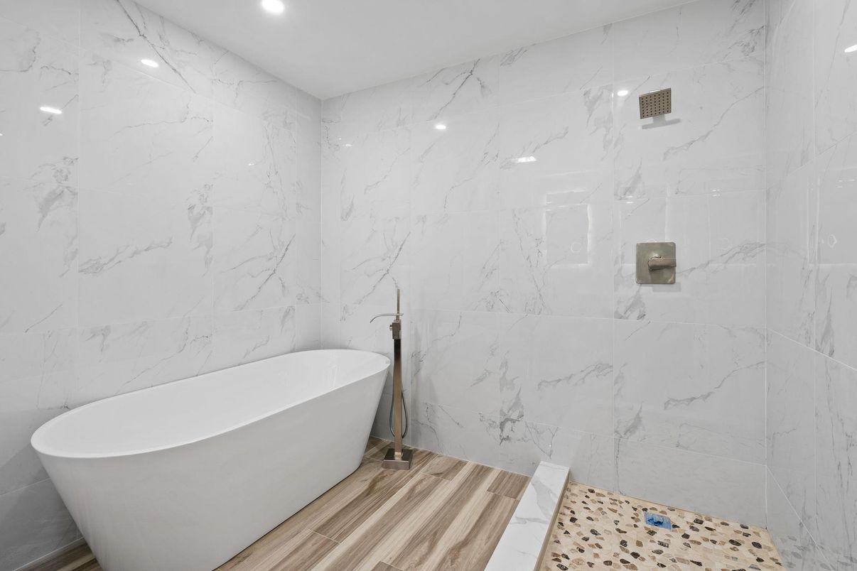 Bathroom, Free Standing Baths, Interior, Marble Walls, Recessed Lighting, Wood Texture Flooring