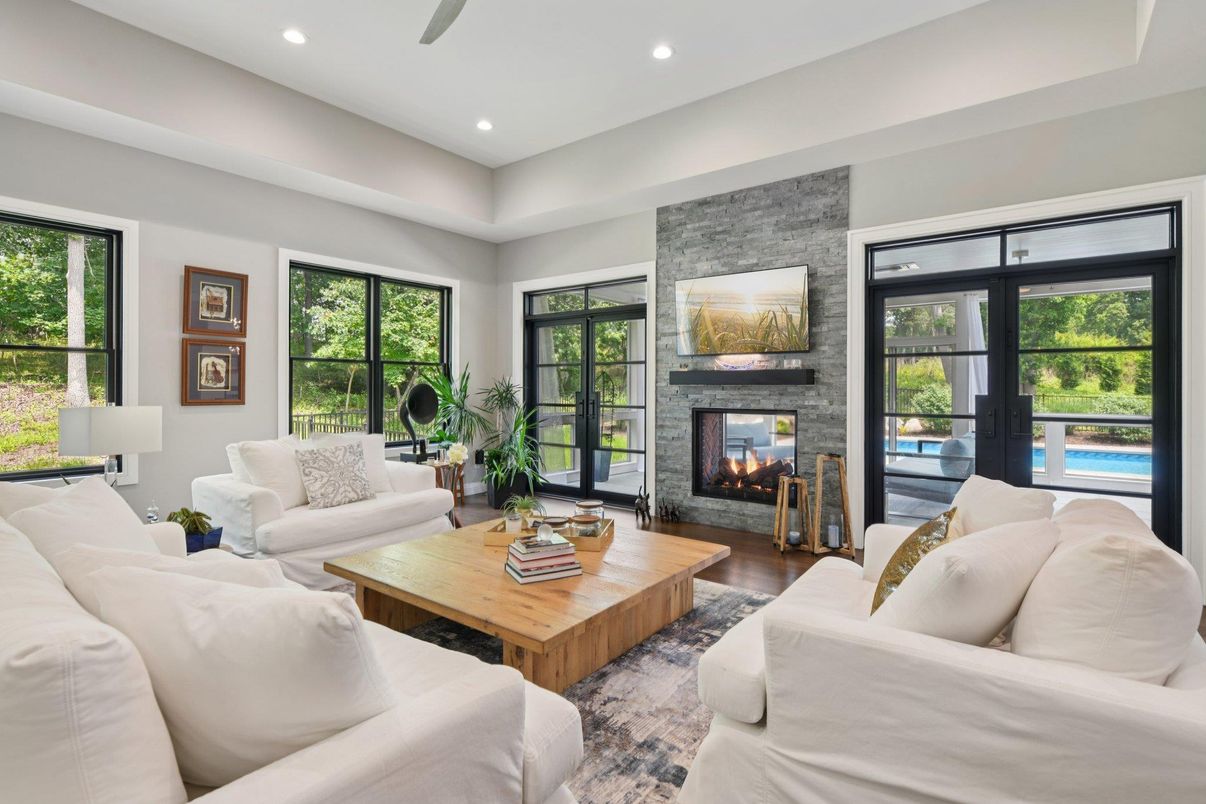 Fireplace, Interior, Living room, Recessed Lighting, Stone Walls, Wood Texture Flooring