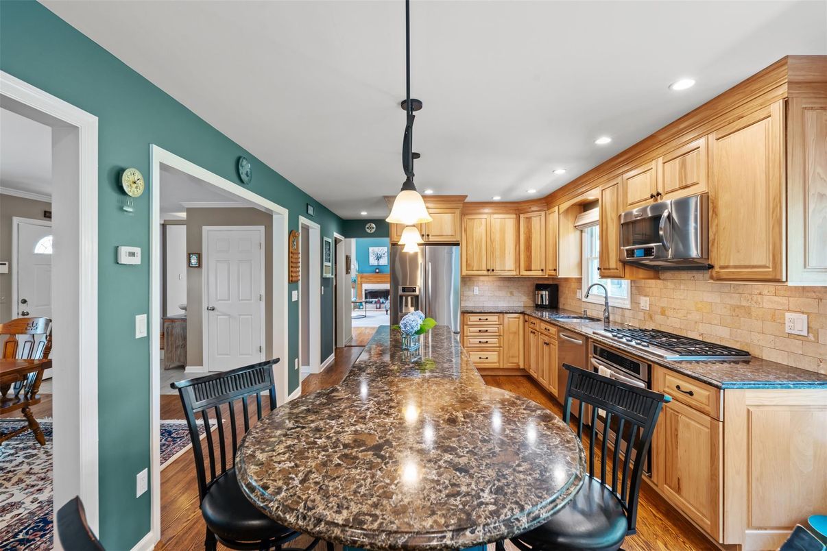 Dining room, Interior, Kitchen, Pendant Lights, Recessed Lighting, Stainless Steel Appliances, Wood Texture Flooring