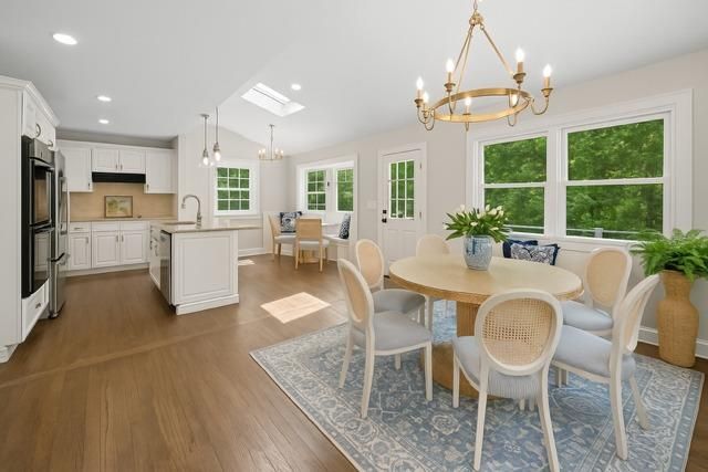 Chandelier, Dining room, Interior, Kitchen, Pendant Lights, Recessed Lighting, Stainless Steel Appliances, Wood Texture Flooring