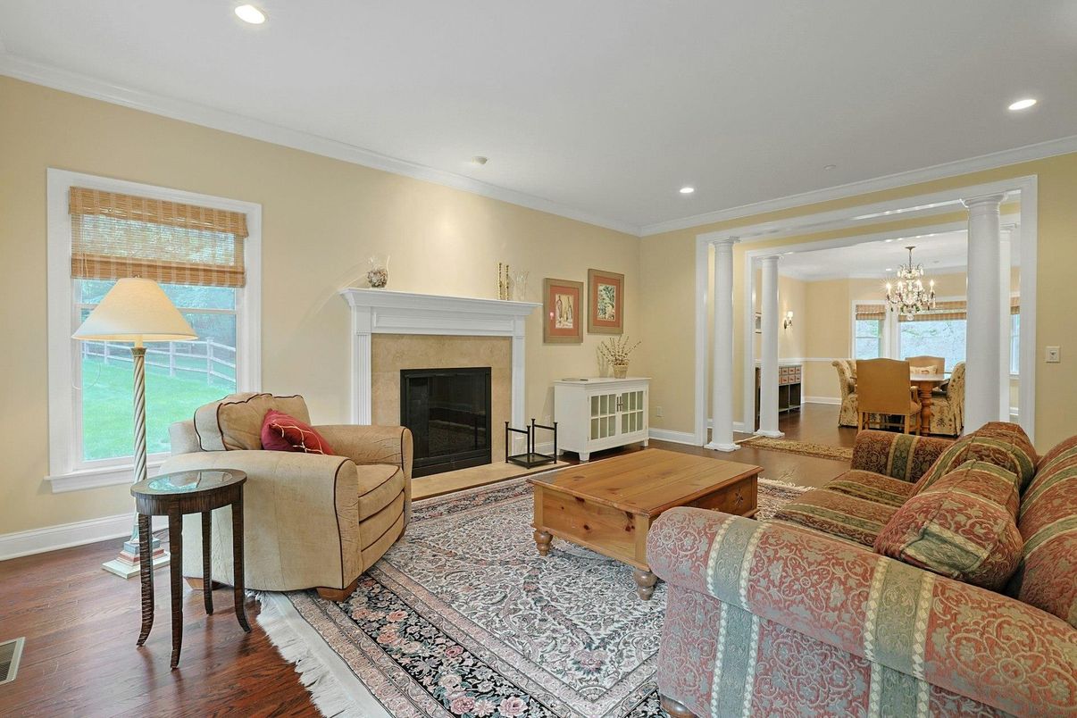 Chandelier, Dining room, Fireplace, Interior, Living room, Recessed Lighting, Wood Texture Flooring