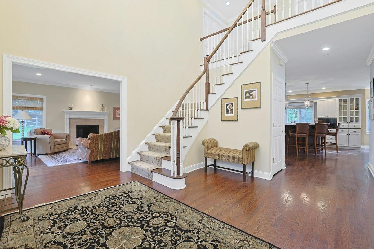 Chandelier, Dining room, Fireplace, Interior, Living room, Pendant Lights, Recessed Lighting, Wood Texture Flooring