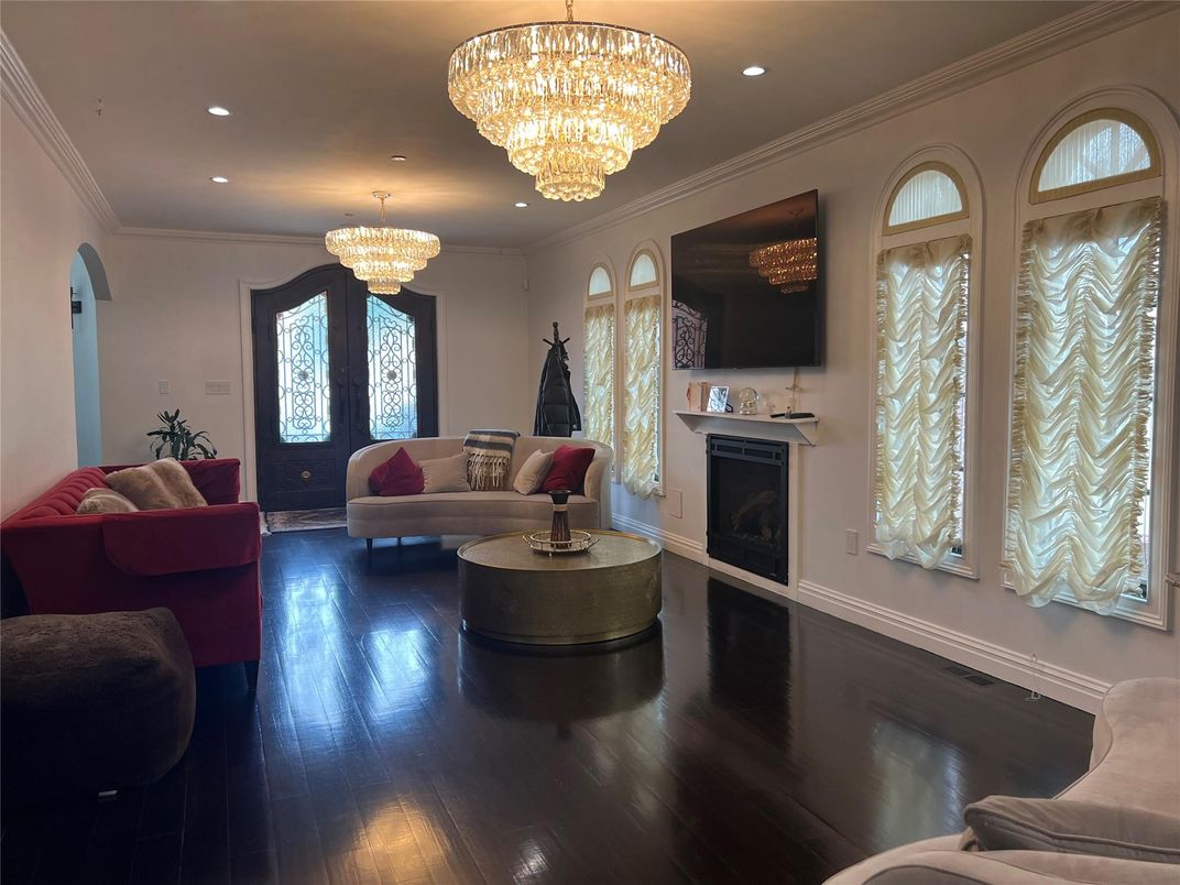 Chandelier, Fireplace, Interior, Living room, Recessed Lighting, Wood Texture Flooring