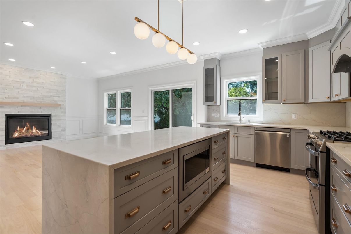 Fireplace, Interior, Kitchen, Pendant Lights, Recessed Lighting, Stainless Steel Appliances, Wood Texture Flooring