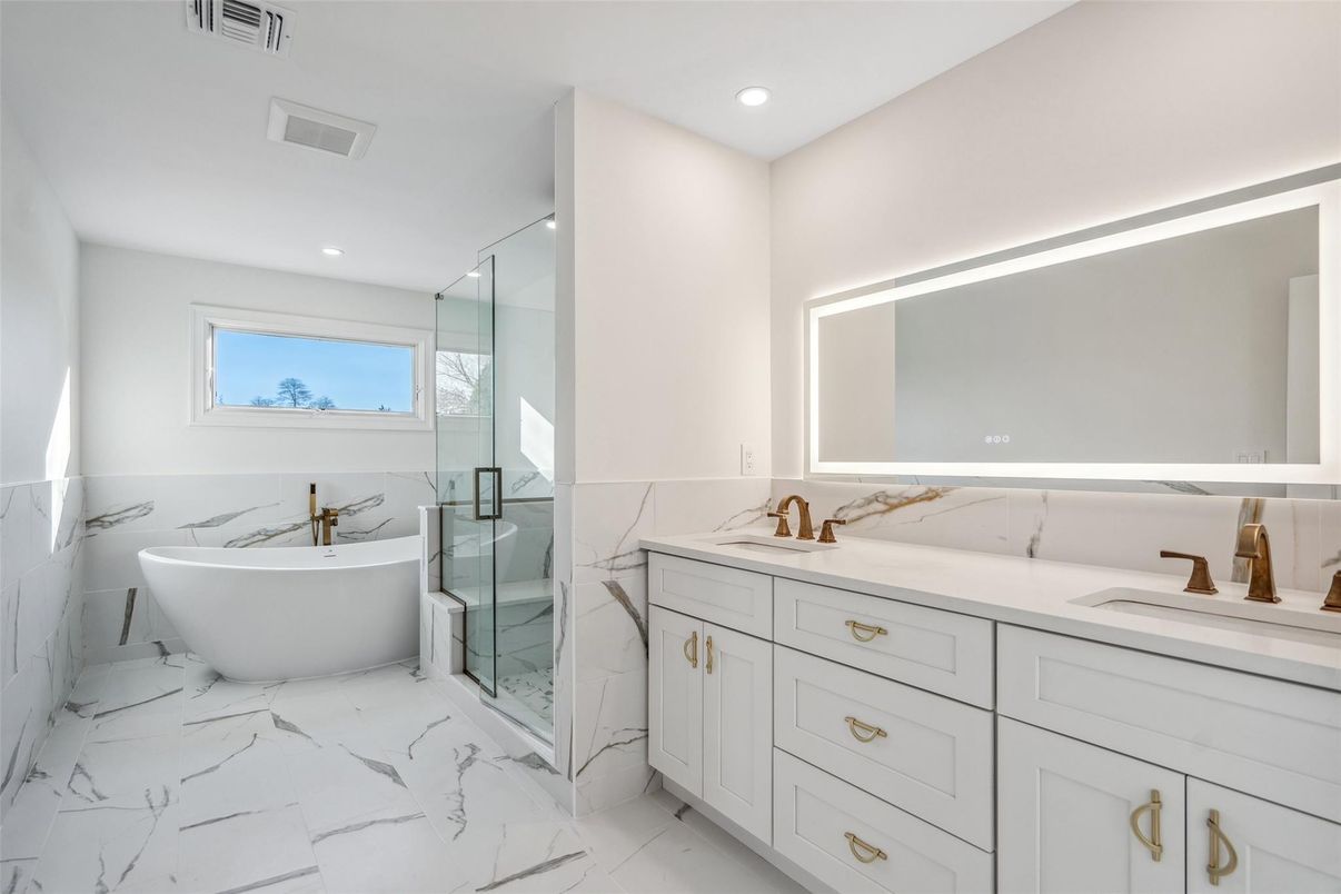 Bathroom, Dual Sink Vanities, Free Standing Baths, Glass Shower, Interior, Marble, Marble Walls, Recessed Lighting