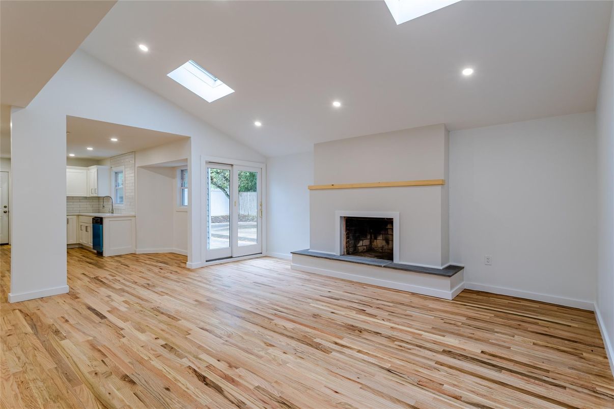Empty room, Fireplace, Interior, Kitchen, Recessed Lighting, Wood Texture Flooring