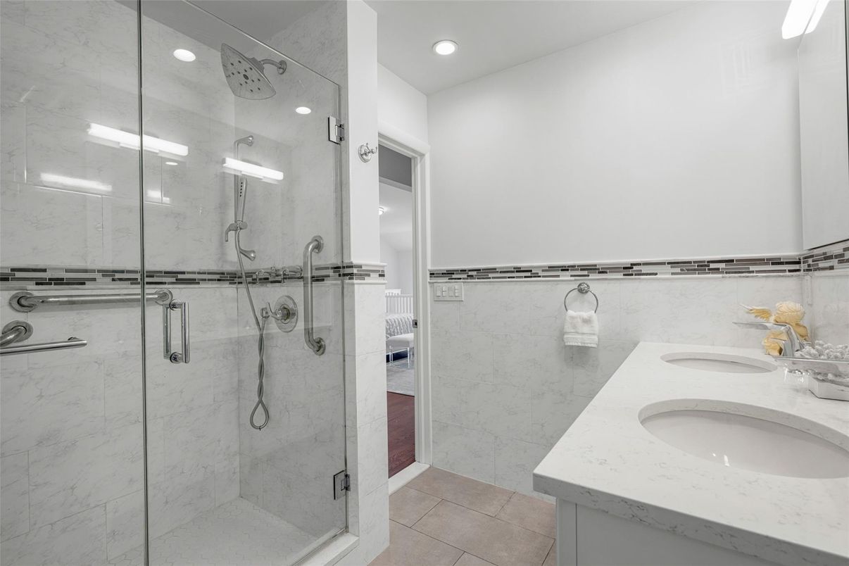 Bathroom, Dual Sink Vanities, Glass Shower, Interior, Marble Walls, Recessed Lighting