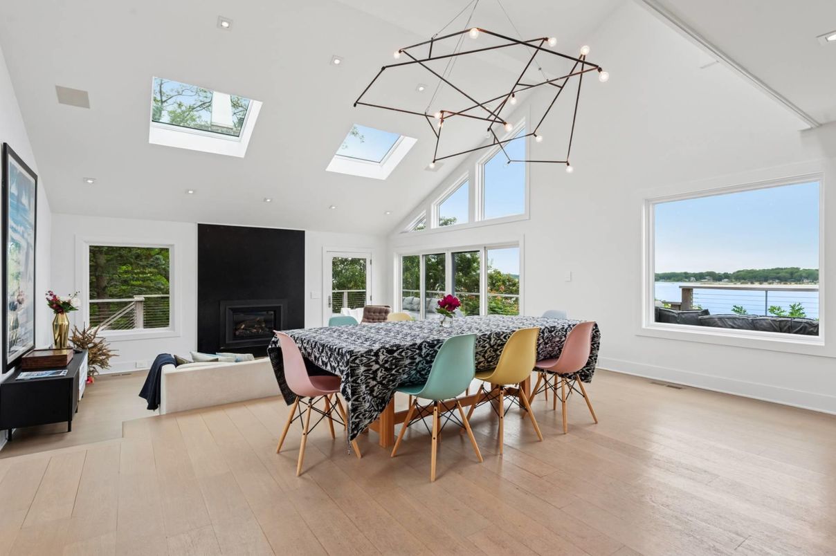 Dining room, Fireplace, Interior, Living room, Pendant Lights, Recessed Lighting, Water, Wood Texture Flooring